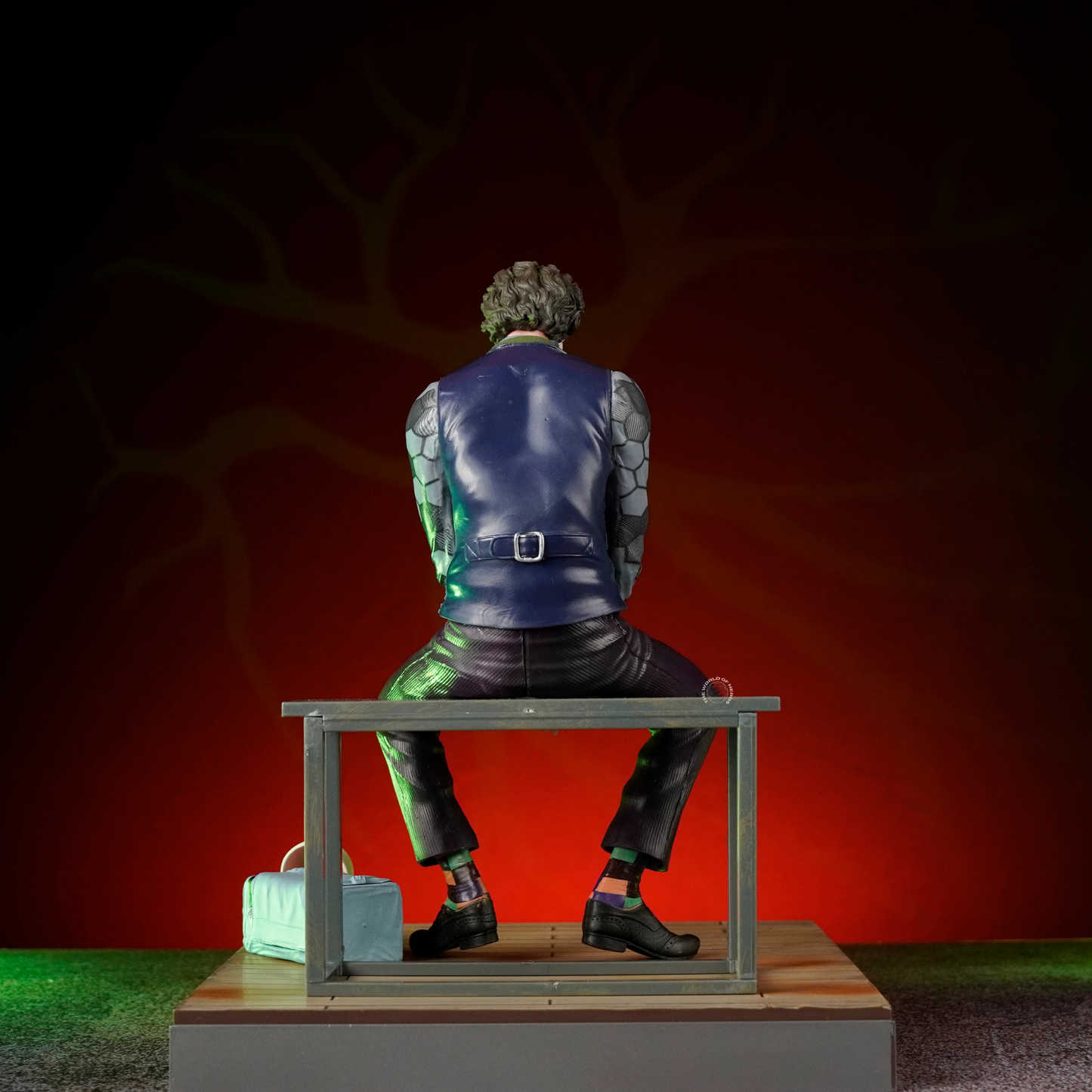 DC Joker Seated Collector Figure with Mask | Trade Supply